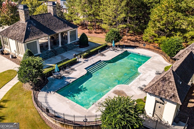 view of swimming pool featuring a patio area