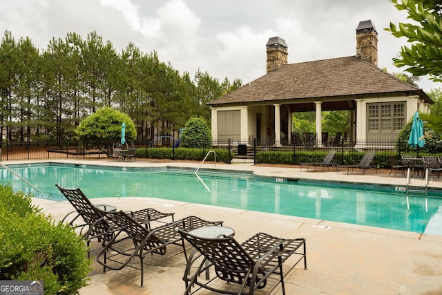 view of pool featuring a gazebo and a patio