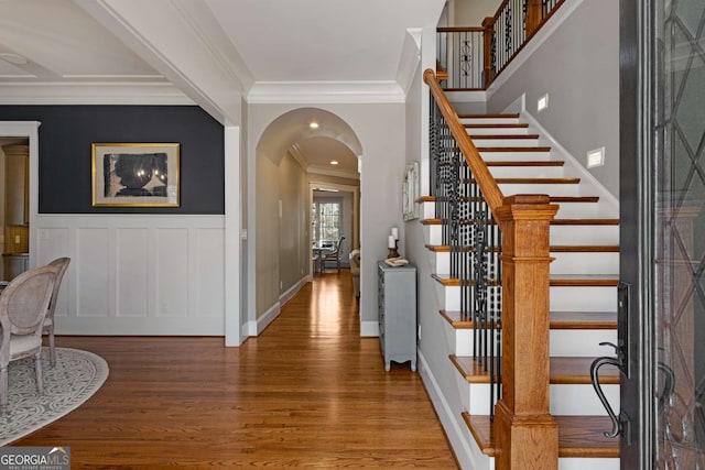 entryway featuring crown molding and wood-type flooring