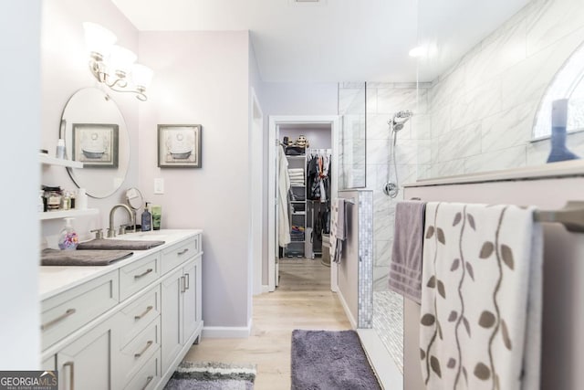 bathroom featuring vanity and a tile shower