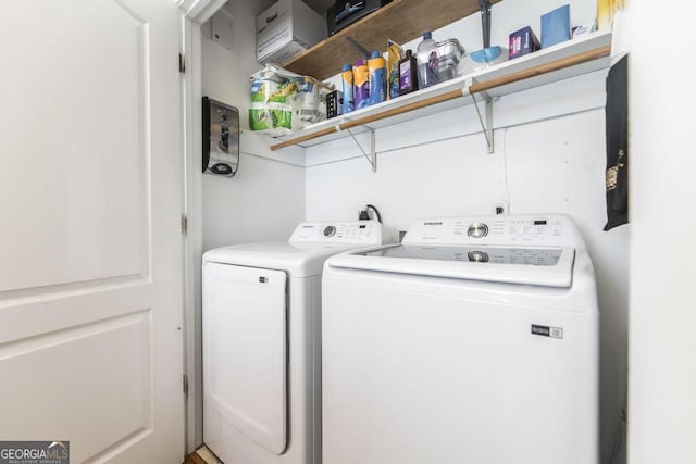 laundry area with separate washer and dryer