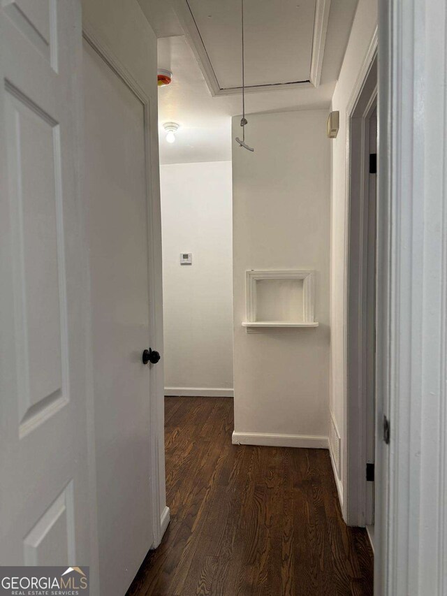 bedroom with dark hardwood / wood-style floors