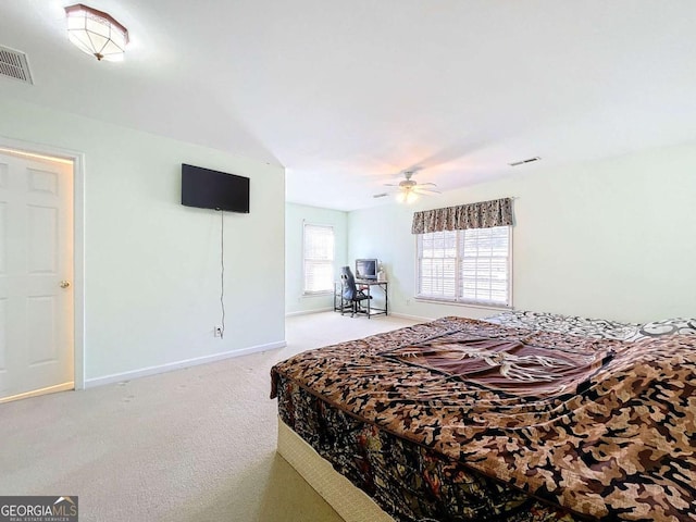 bedroom with ceiling fan and carpet flooring