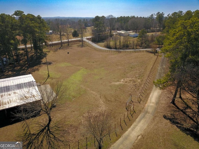 birds eye view of property featuring a rural view