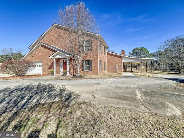 front facade with a carport