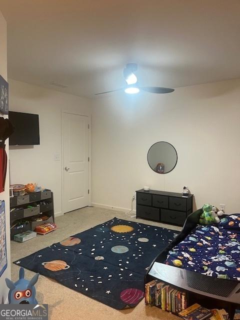 bedroom with ceiling fan and carpet flooring