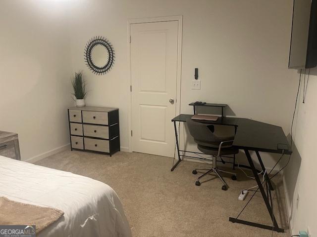 bedroom featuring light colored carpet