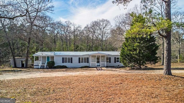 manufactured / mobile home featuring covered porch