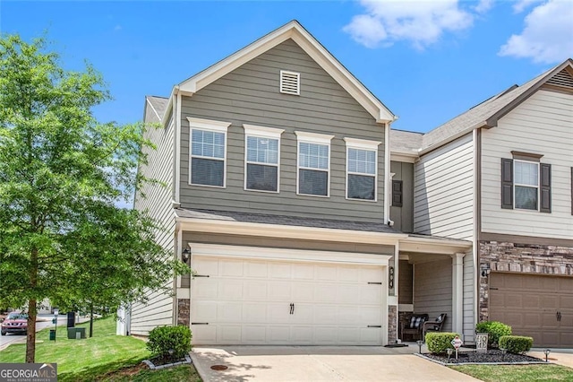 view of front of house with a garage and a front lawn