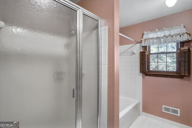 full bath featuring a garden tub, visible vents, a shower stall, tile patterned floors, and wallpapered walls