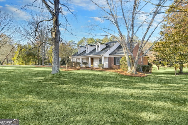 view of front of property with a porch and a front yard