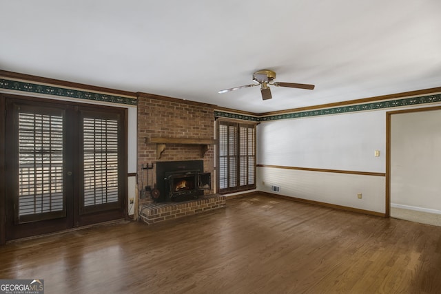 unfurnished living room with ceiling fan, dark wood-type flooring, baseboards, ornamental molding, and french doors