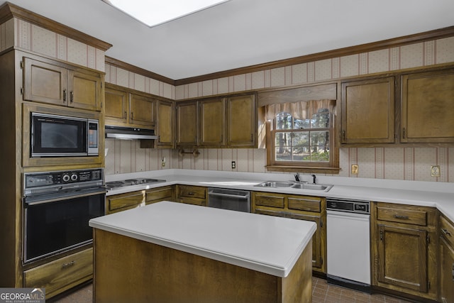 kitchen with black oven, a sink, built in microwave, and wallpapered walls