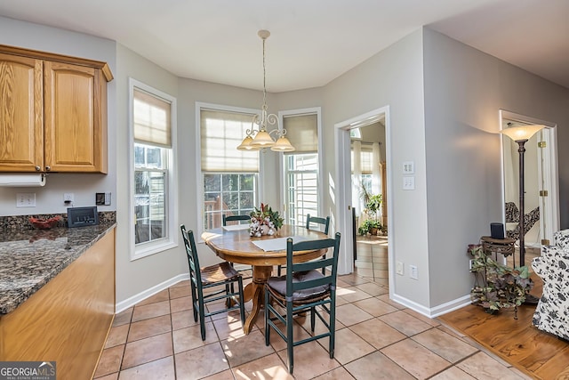 dining space featuring light tile patterned floors