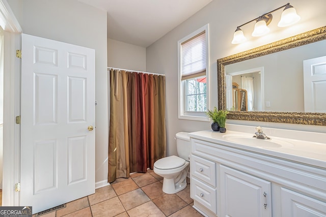 full bathroom with tile patterned flooring, vanity, toilet, and shower / bathtub combination with curtain