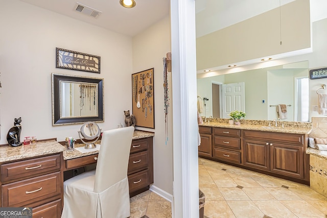 bathroom featuring tile patterned floors and vanity