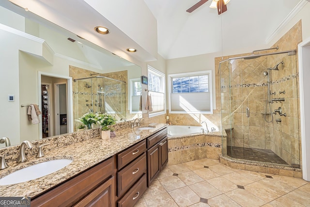 bathroom featuring ornamental molding, lofted ceiling, shower with separate bathtub, and vanity