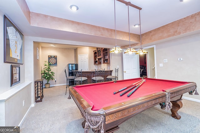 rec room featuring light colored carpet, bar area, and pool table