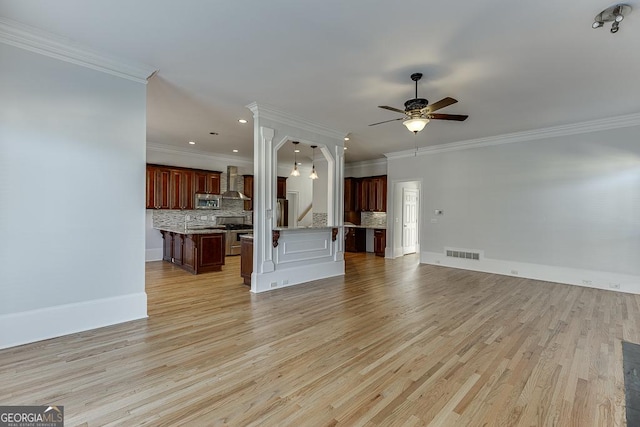 unfurnished living room featuring ornamental molding, ceiling fan, and light wood-type flooring