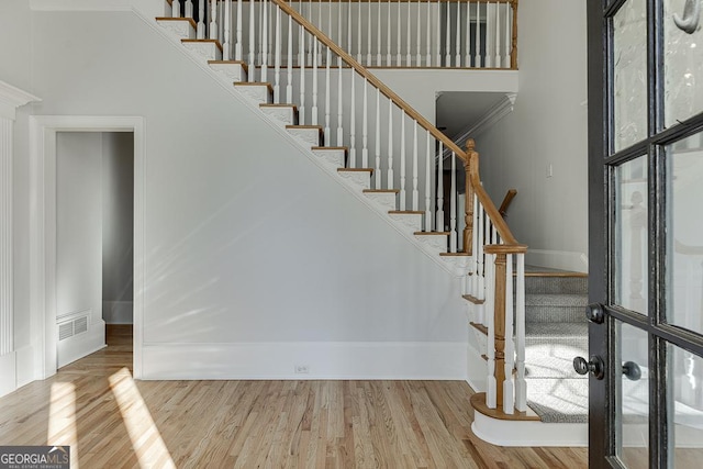 stairway featuring hardwood / wood-style floors