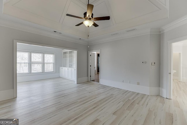 spare room with crown molding, light hardwood / wood-style floors, and ceiling fan