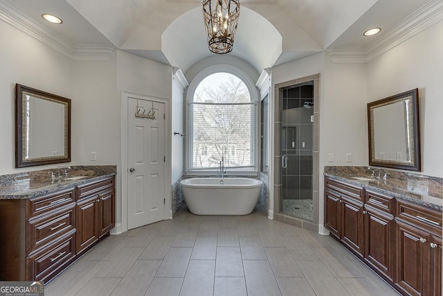 bathroom with lofted ceiling, vanity, and plus walk in shower