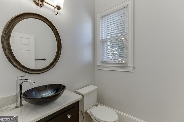 bathroom featuring vanity and toilet