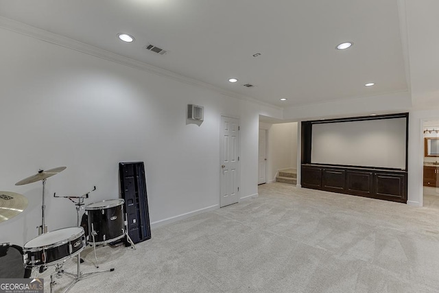 carpeted home theater with crown molding