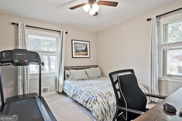 carpeted bedroom featuring ceiling fan