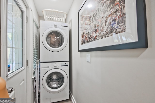 washroom with stacked washer / dryer