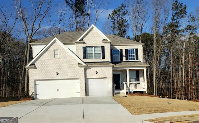 view of front of house with a porch, concrete driveway, brick siding, and an attached garage