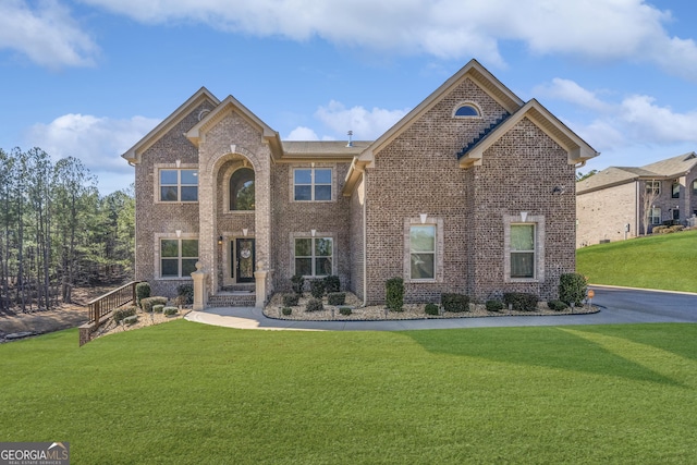 view of property featuring a front yard