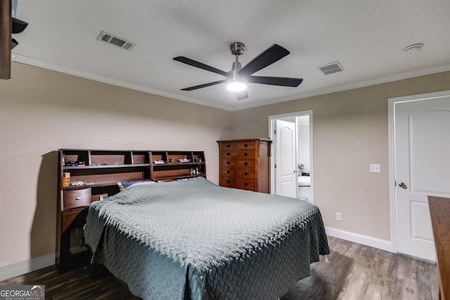 bedroom featuring crown molding, ceiling fan, ensuite bathroom, and dark hardwood / wood-style floors