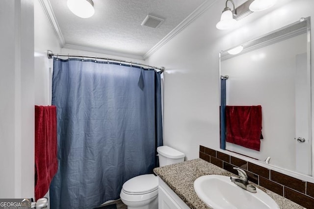 bathroom featuring ornamental molding, toilet, vanity, and a textured ceiling