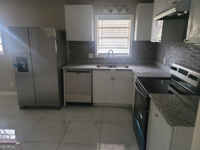 kitchen featuring white cabinetry, appliances with stainless steel finishes, and sink