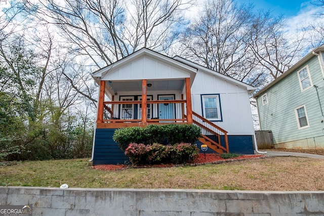 view of front of home with a front lawn and a porch