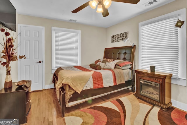 bedroom featuring ceiling fan and light hardwood / wood-style floors