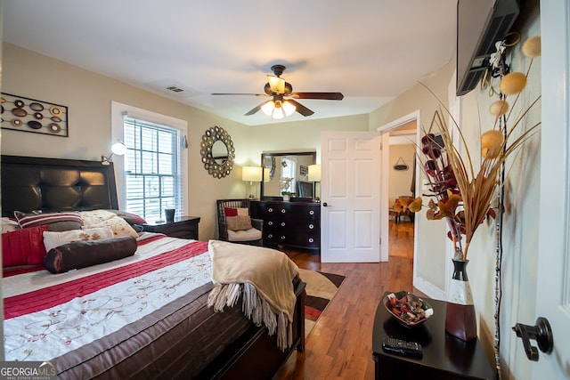 bedroom featuring hardwood / wood-style flooring and ceiling fan