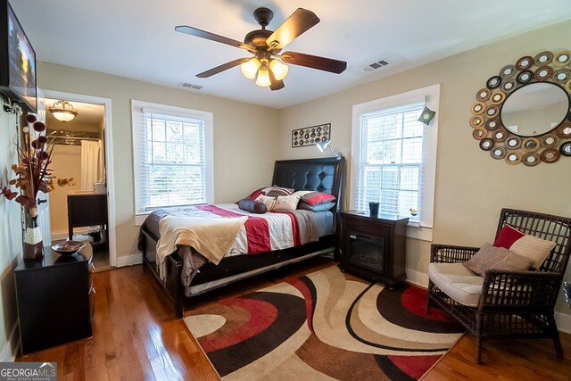 bedroom with ceiling fan and light hardwood / wood-style floors