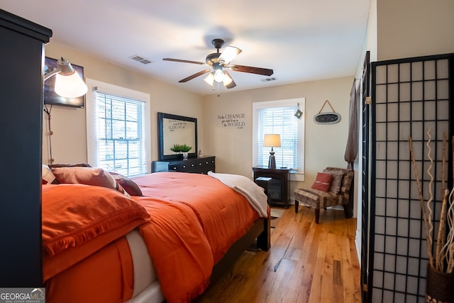 bedroom featuring hardwood / wood-style floors and ceiling fan