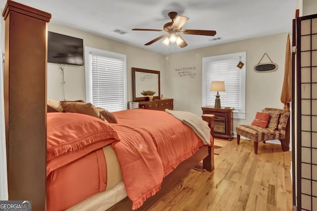 bedroom featuring ceiling fan and light wood-type flooring