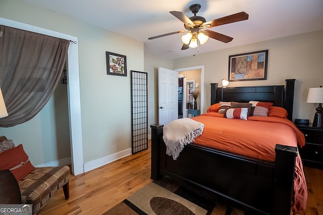 bedroom with hardwood / wood-style floors and ceiling fan