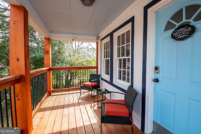 wooden terrace with a porch