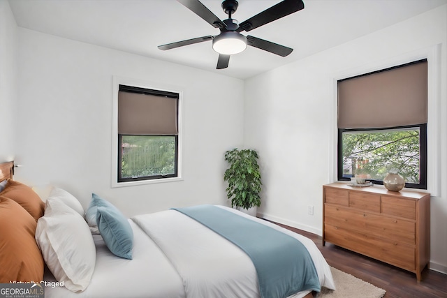 bedroom featuring dark wood-type flooring and ceiling fan