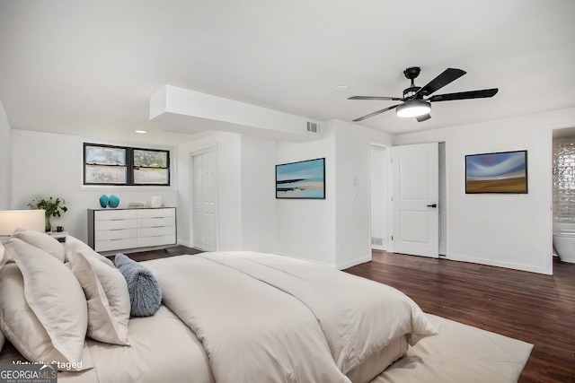 bedroom with ceiling fan and dark hardwood / wood-style flooring