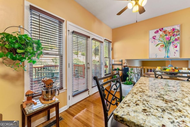 dining area featuring ceiling fan and light hardwood / wood-style flooring