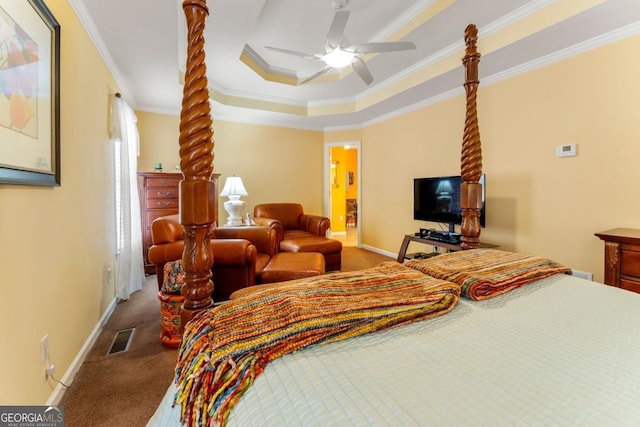 bedroom with crown molding, ceiling fan, carpet flooring, and a raised ceiling