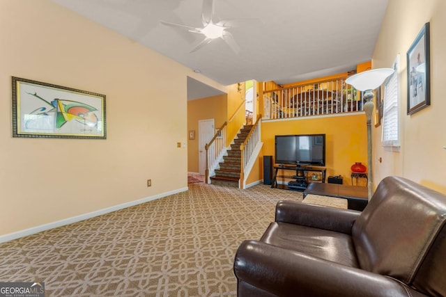 living room with ceiling fan and light carpet