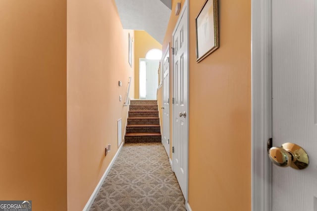 hallway featuring light carpet