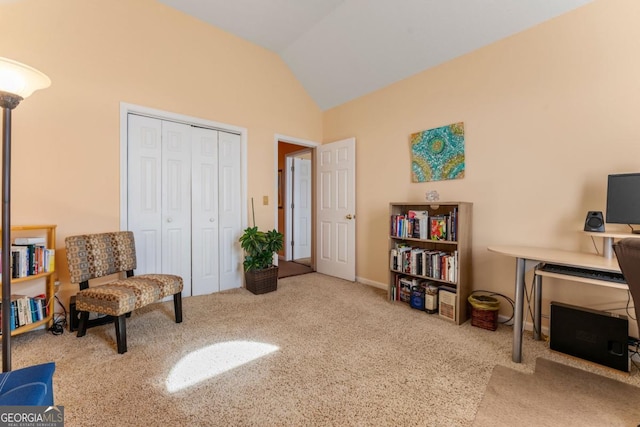 sitting room featuring lofted ceiling and light colored carpet